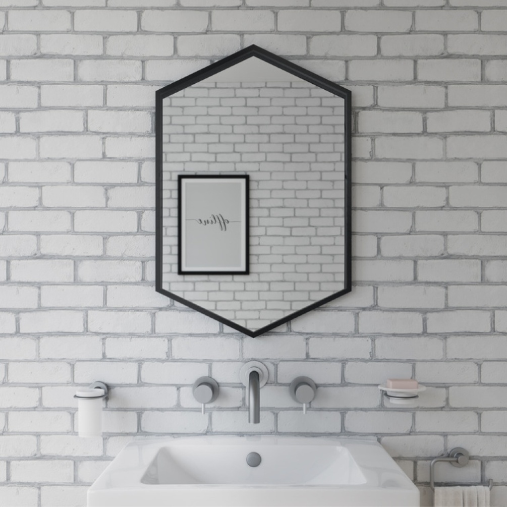 Product Lifestyle image of Origins Living Docklands Hexagonal 500mm x 750mm Black Mirror mounted on a white bathroom wall B375516